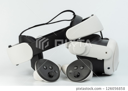 High-tech virtual reality headset and controllers for immersive gaming experience High-tech virtual reality headset and controllers for immersive gaming experience 126056858