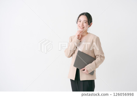 A woman in her 20s in a suit 126056998