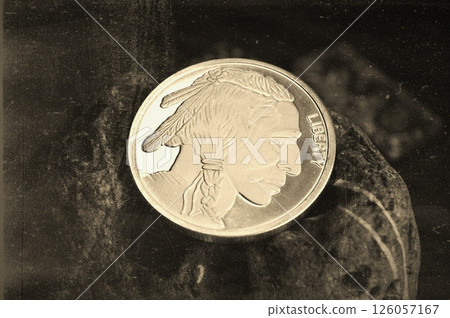 United States Pure Silver coin with North American Indian head. Old photo effect. 126057167