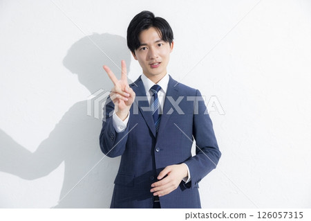 Man smiling and talking at the camera 126057315