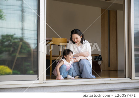 Smiling mother and daughter talking, image of happiness Smiling mother and daughter talking, image of happiness 126057471