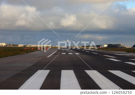 Airplane taking off from the runway (Naha Airport) 126058250