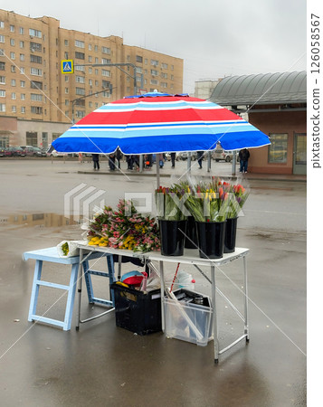 A stall that sells flowers on the street A stall that sells flowers on the street 126058567