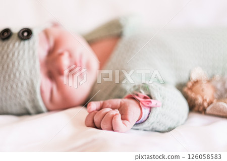Newborn baby sleeping on a blanket. Age 1 week Newborn baby sleeping on a blanket. Age 1 week 126058583