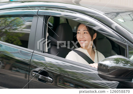 Young woman in a car Young woman in a car 126058870