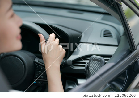 Young woman in a car 126060206