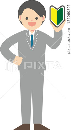 A man in a suit holding up a beginner's mark 126060805