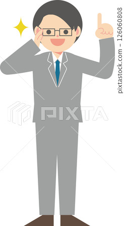A man in a suit wearing glasses pointing up A man in a suit wearing glasses pointing up 126060808
