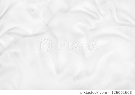 Close up top view of white bedding sheet and wrinkle messy blanket in bedroom after wake up in the morning. 126061668