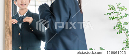 Girls in elementary school, junior high school, and high school uniforms getting ready in the morning Girls in elementary school, junior high school, and high school uniforms getting ready in the morning 126061923