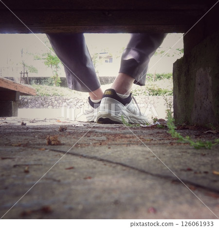 Man relaxing on a park bench 126061933