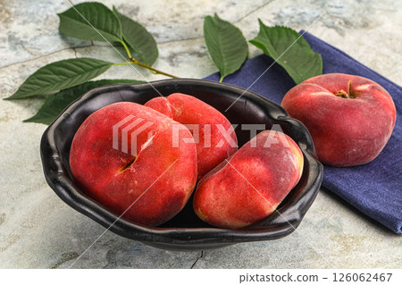 Ripe sweet and juicy Flat peach 126062467