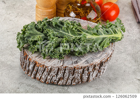 Green Kale cabbage leaves ocer board 126062509