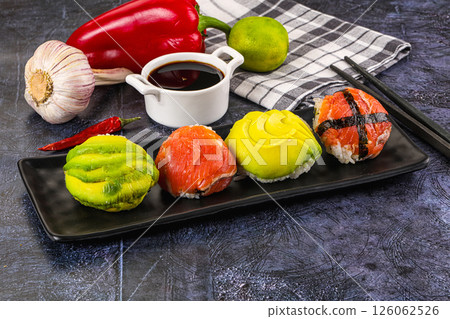 Round tamari sushi with salmon and avocado 126062526