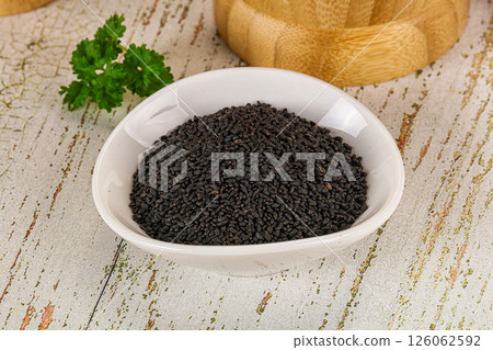 Black dry Nigella seeds in the bowl 126062592