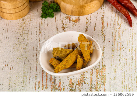Raw dry Tumeric roots heap 126062599