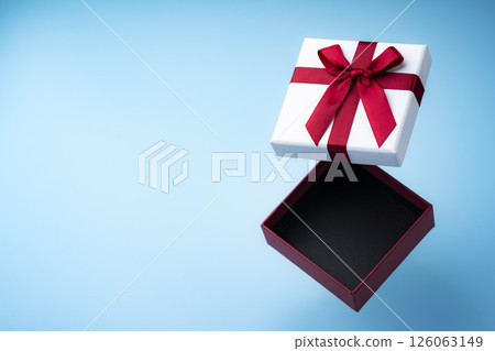 Open gift box and light blue background 126063149
