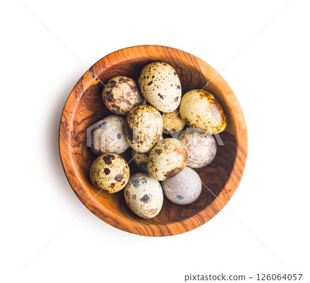 Spotted quail eggs in bowl isolated on white background. 126064057
