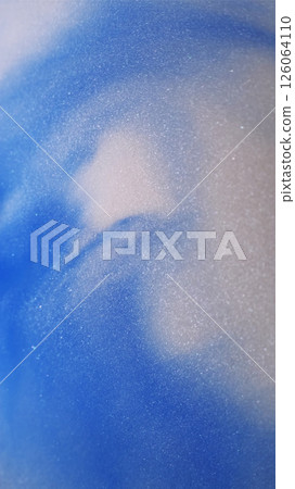 Ink mix flow. Glitter fluid spill. Defocused blue white color paint in shiny water texture floating on abstract marble milky background. Ink mix flow. Glitter fluid spill. Defocused blue white color paint in shiny water texture floating on abstract marble milky background. 126064110