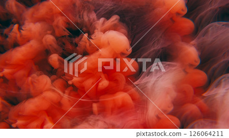 Ink drop explosion. Paint water. Defocused orange purple color ethereal splash liquid floating on abstract dark black art background. Ink drop explosion. Paint water. Defocused orange purple color ethereal splash liquid floating on abstract dark black art background. 126064211