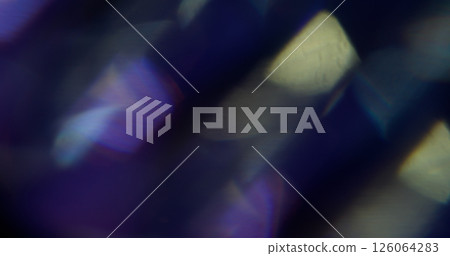 Radiant light. Blur flare magic. Defocused yellow purple color texture spectrum rainbow on abstract dark black background. Radiant light. Blur flare magic. Defocused yellow purple color texture spectrum rainbow on abstract dark black background. 126064283