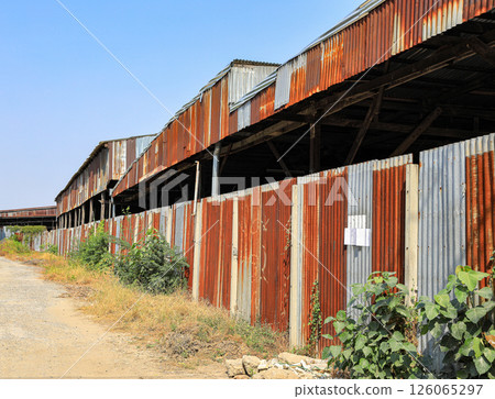 Panoramic old, grunge, abandoned urban warehouse made from Metal Sheet or Galvanized Iron plate. industrial background. 126065297