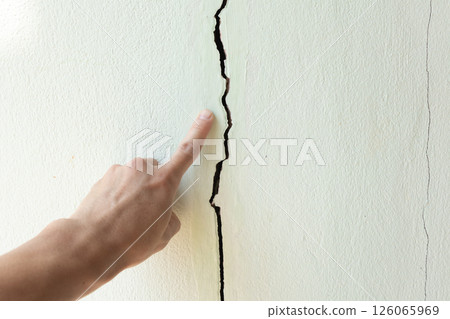 Crack or damage on concrete wall need repair. Crack or damage on concrete wall need repair. 126065969