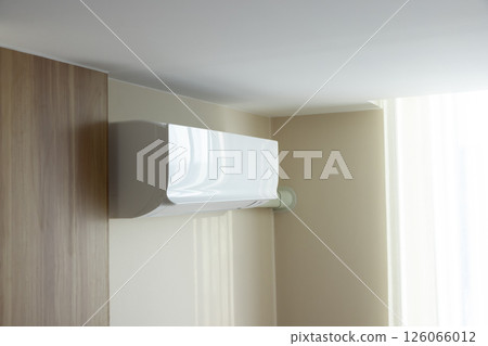 Air conditioner in room for cool climate. 126066012