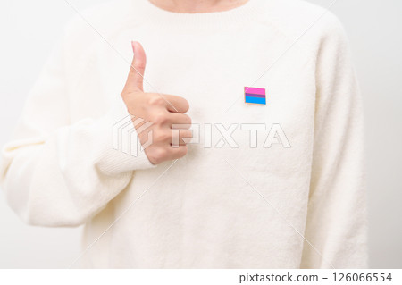 Bisexuality Celebrate Day and LGBT pride month, LGBTQ or LGBTQIA concept. Hand holding purple, pink and blue flag shape for Lesbian, Gay, Bisexual, Transgender, Queer, Pansexual, Marriage Equality Law 126066554
