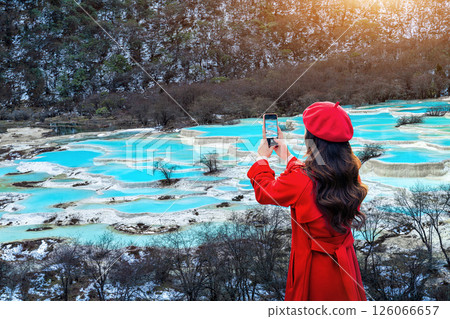 Tourist standing at Huanglong national park in winter, Sichuan in China. 126066657
