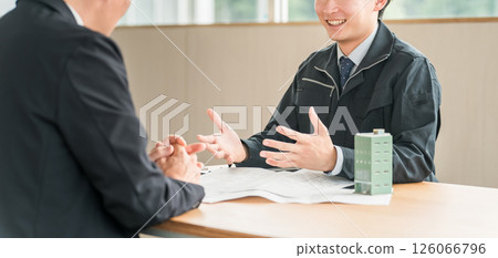 Young Asian businessman in work clothes having a meeting for a building or tenant negotiation 126066796