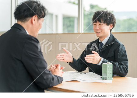 Young Asian businessman in work clothes having a meeting for a building or tenant negotiation 126066799