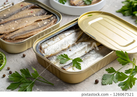 Canned Sardines in Olive Oil in Open Metal Tin Containers 126067521
