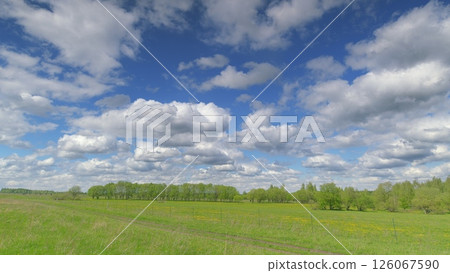 Vibrant Landscape Under a Beautiful, Cloudy Sky A Scene of Natural Wonder and Peacefulness Time lapse. Vibrant Landscape Under a Beautiful, Cloudy Sky A Scene of Natural Wonder and Peacefulness Time lapse. 126067590