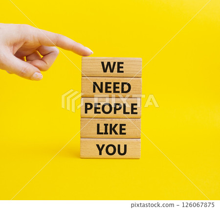 Hiring symbol. Wooden blocks with words We need People like You. Businessman hand. Beautiful yellow background. Business and Hiring concept. Copy space. 126067875