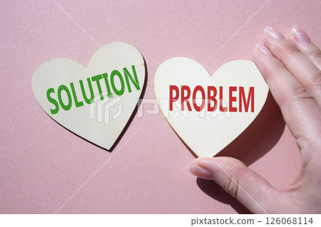 Solution vs Problem symbol. Concept word Solution vs Problem on wooden hearts. Businessman hand. Beautiful pink background. Business and Solution vs Problem concept. Copy space Solution vs Problem symbol. Concept word Solution vs Problem on wooden hearts. Businessman hand. Beautiful pink background. Business and Solution vs Problem concept. Copy space 126068114