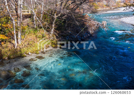 Japan's leading mountain resort, Kamikochi in late autumn, the crystal clear blue Azusa River Japan's leading mountain resort, Kamikochi in late autumn, the crystal clear blue Azusa River 126068653