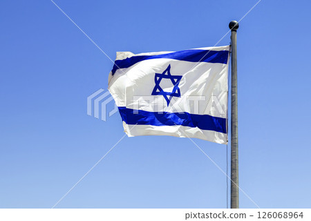 The Israeli flag waving in the bright sunlight The Israeli flag waving in the bright sunlight 126068964
