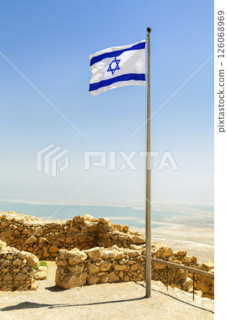 Israel flag over ruins of Masada Fortress Israel flag over ruins of Masada Fortress 126068969