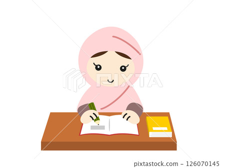 A girl wearing a hijab sitting at a desk studying 126070145