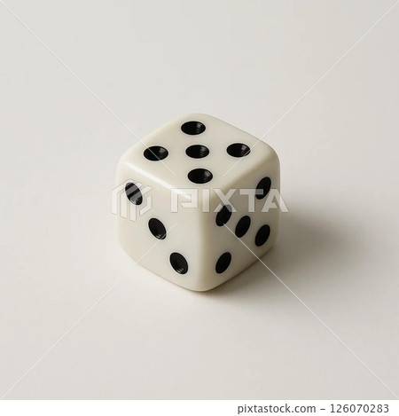 A close-up shot of a classic white dice with black dots. A close-up shot of a classic white dice with black dots. 126070283