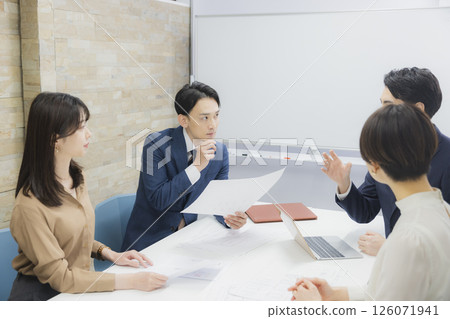 People having a meeting in a conference room 126071941