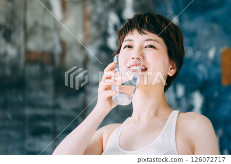Young woman drinking water Hydration 126072717