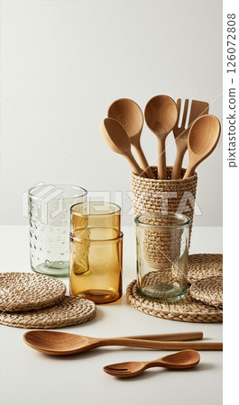 Rustic Kitchen Collection Handcrafted Wooden Utensils, and Glass Storage Jars in Minimalist Natural Home Decor Arrangement 126072808