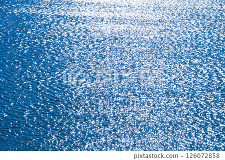 The blue water surface reflecting the sunlight 126072858