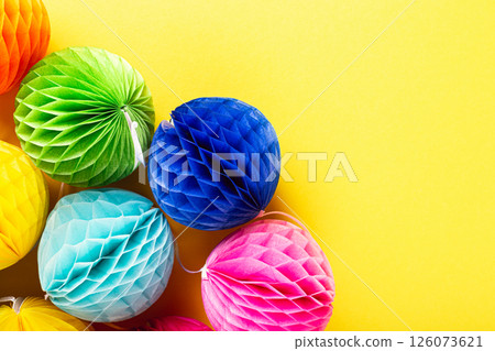 Festive background with colorful paper balls. 126073621