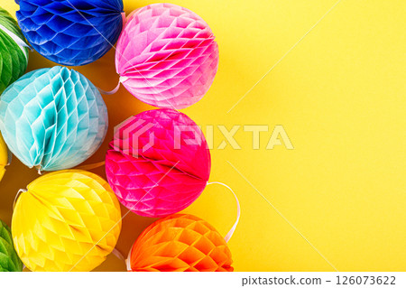 Festive background with colorful paper balls. Festive background with colorful paper balls. 126073622