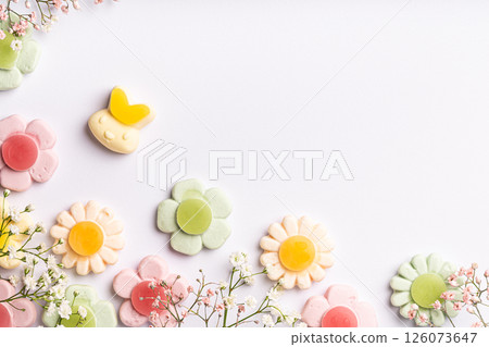 Colorful Flower-Shaped Gummy Candies on White Background 126073647