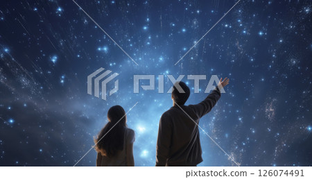 Two individuals gazing at a starry night sky filled with cosmic wonders and bright stars Two individuals gazing at a starry night sky filled with cosmic wonders and bright stars 126074491
