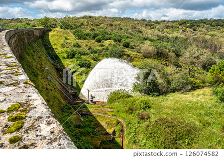 Water sweeping out of the Povoa e Meadas Dam. Natural reserve in Castelo de Vide, Portugal 126074582